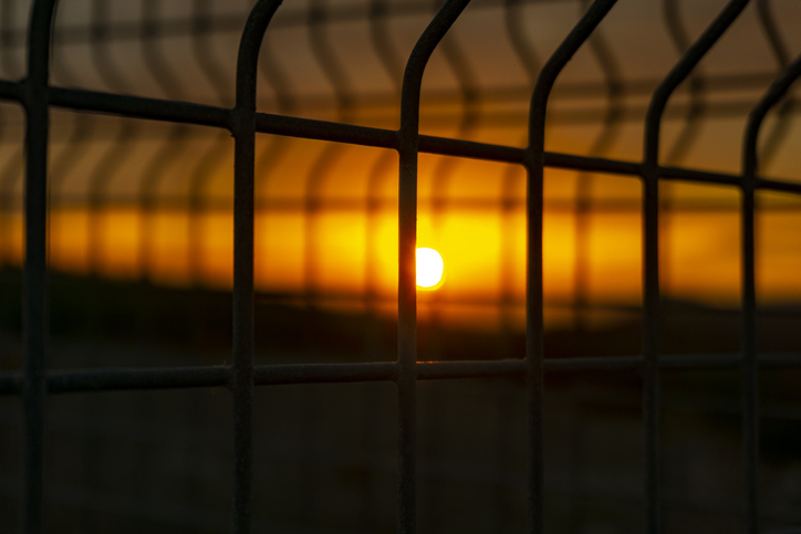 Sun over prison walls 